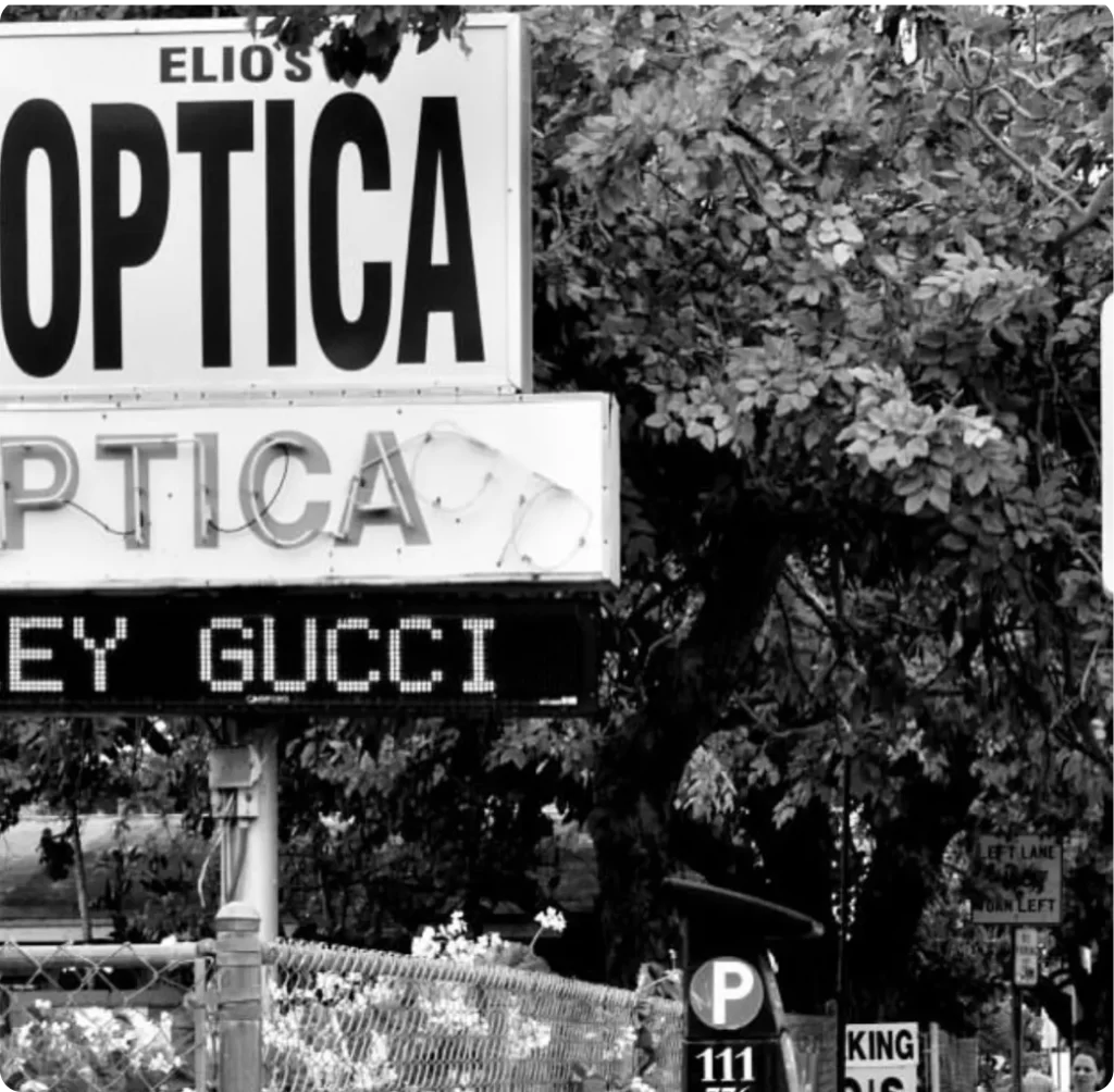 a sign on a pole Elios optical