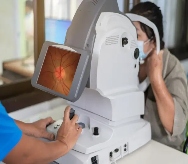 a woman looking at a machine Elios optical